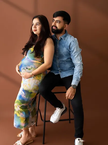 A stylish couple's portrait where they are looking off-camera together, creating a sense of shared dreams and anticipation.