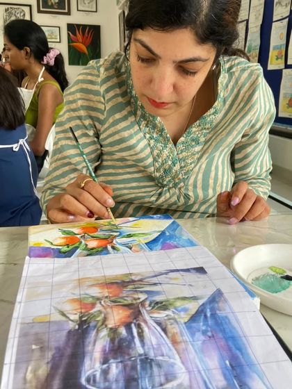 This student is learning to paint a still life with glass and fruit, a great exercise for understanding light and reflection in our watercolor course.