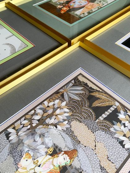 Our popular gold metal frame adds a touch of richness and warmth, perfectly showcasing the exquisite, detailed beauty of this client's traditional Indian artwork.