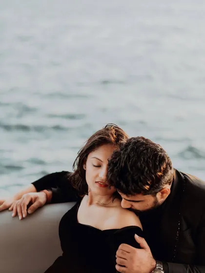 An intimate and romantic moment on a yacht in Dubai. The focus is on the tender gesture and the feeling of being lost in their own world, even amidst the grand cityscape. These are the moments that feel like a scene from a movie.