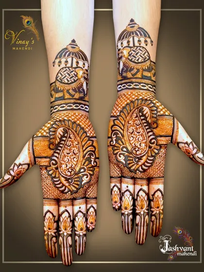 A symmetrical design with large paisley motifs on the palms and elephants under canopies on the wrists.