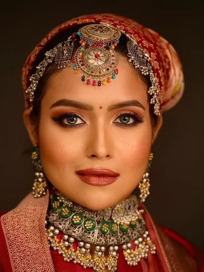A stunning close-up portrait. The student has created a beautiful, warm smokey eye that makes the model's eyes pop.