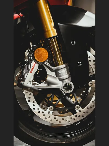 We work with the best components to deliver performance you can feel. Here's a close-up of the Brembo brakes and Öhlins front forks on a Ducati Panigale V4 we prepped.