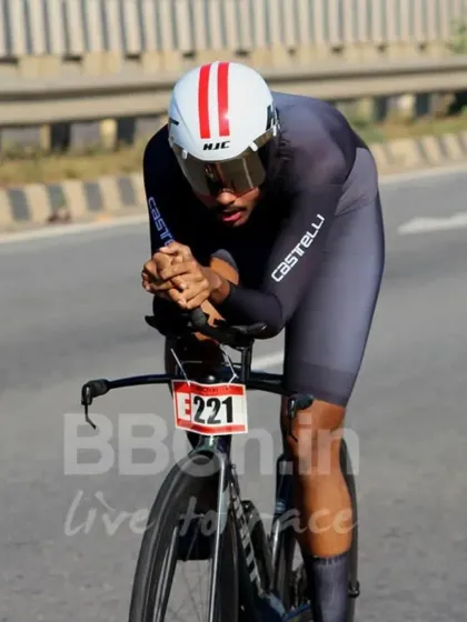 The race of truth. A rider in full aerodynamic form pushes against the clock during a Namma ITT (Individual Time Trial), a pure test of individual power and endurance.