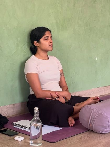 A moment of zen during our journaling workshop. A participant sits in quiet reflection, absorbing the lessons and preparing to write.