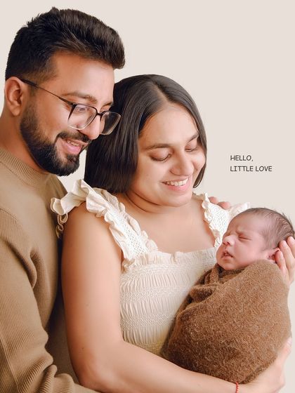A slightly different angle from the same session, capturing the family's loving interaction. These variations ensure we capture the perfect expression and connection.