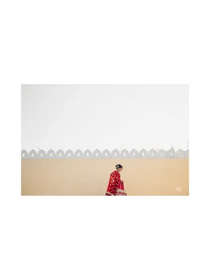 A minimalist and artistic shot of the bride, using negative space to create a powerful and serene image.