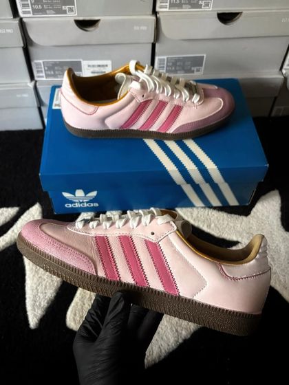 A pair of Adidas Sambas in a custom pink bubblegum colorway.
