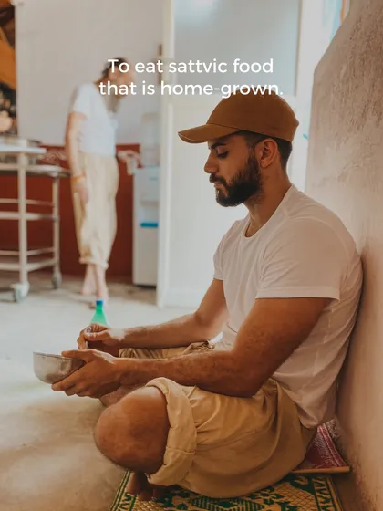 We believe in nourishing the body with pure, sattvic food that is home-grown. A student enjoys a simple meal, a practice that is central to the yogic lifestyle.