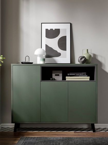 Our modular systems extend beyond the kitchen. This matching sideboard in metallic green creates a cohesive look throughout your living space.