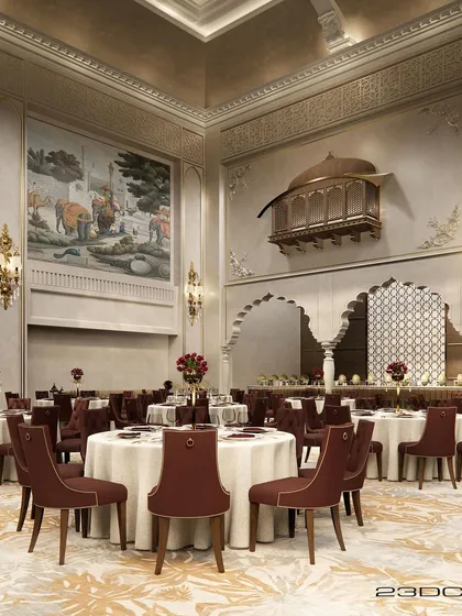 We believe luxury is in the details. This view of a grand banquet hall interior showcases our blend of Rajasthani and Islamic architectural elements, featuring a traditional jharokha, custom maroon seating, and intricate wall murals to create a regal atmosphere for any celebration.