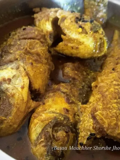 Gawrom bhaat er shathey bataa machher shorshe jhol. This simple dish of Bata fish in a light mustard gravy is a lip-smacking delicacy, especially on a cool afternoon.