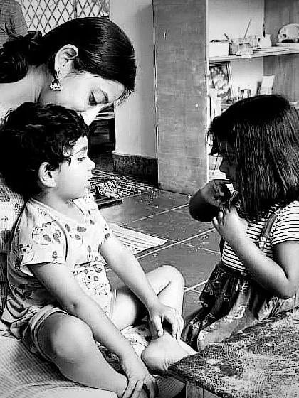 A quiet moment of connection between a mother and children, a reminder of what lies at the core of our work. We aim to support these spontaneous acts of affection and help you nurture your child's innate capacity for love and community.