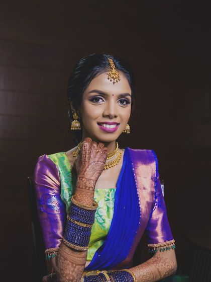 A happy, smiling portrait of the bride. The makeup enhances her features and her joyful expression, creating a beautiful memory of her engagement day.