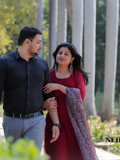 A candid walking shot from a pre-wedding session in a park. I aim to capture these natural interactions that tell your story.