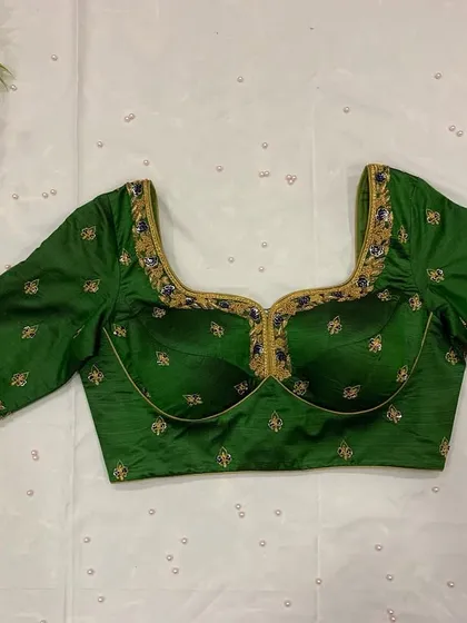 A padded version of the bottle green blouse, offering a different style of fit and structure.