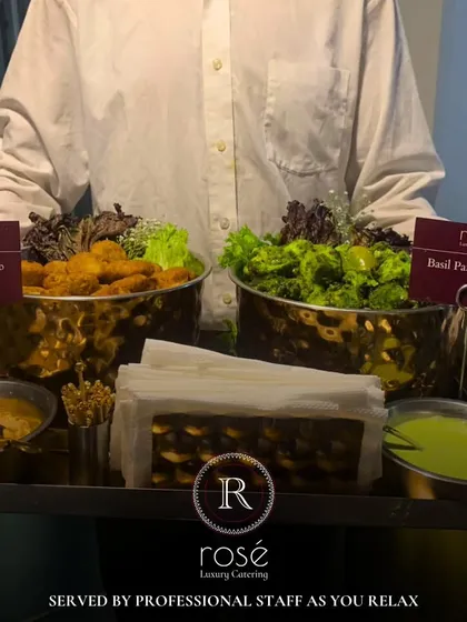 A server presents bowls of our signature Truffle Dahi Kebab and Basil Paneer Tikka. We ensure our professional staff serves you and your guests as you relax and enjoy the event.
