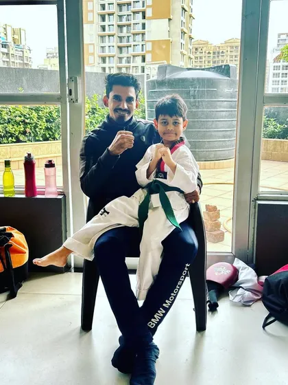 A moment with one of my young green belt students after a good training session.