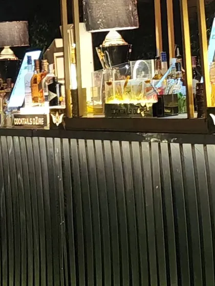 A sleek and modern bar design with clean lines and integrated lighting. This setup is perfect for corporate events or contemporary cocktail parties where sophistication is key.