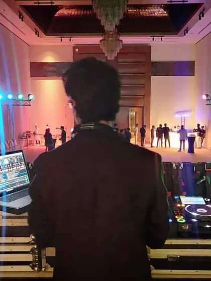My view from the DJ booth, getting ready to kick off an epic night. Seeing the stage, the lights, and the expectant crowd is a feeling like no other. This is where the magic begins.