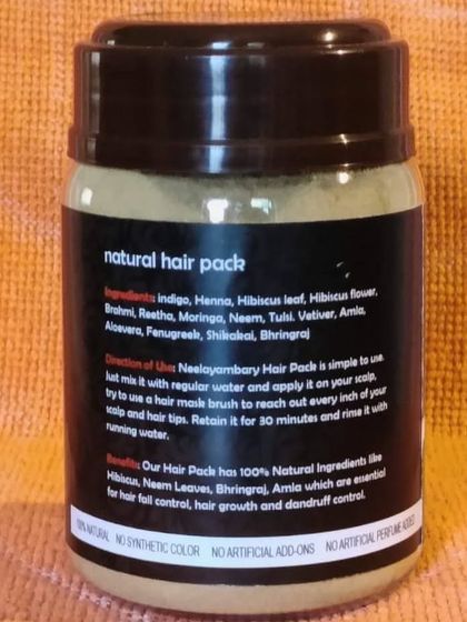 The back of our Natural Hair Pack, showing the list of all-natural ingredients like indigo, henna, hibiscus, and bhringraj. I believe in being completely transparent about what goes into my products.