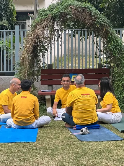 A small group of trainee teachers giving and receiving feedback after a practice teaching session. This peer-to-peer learning is invaluable.