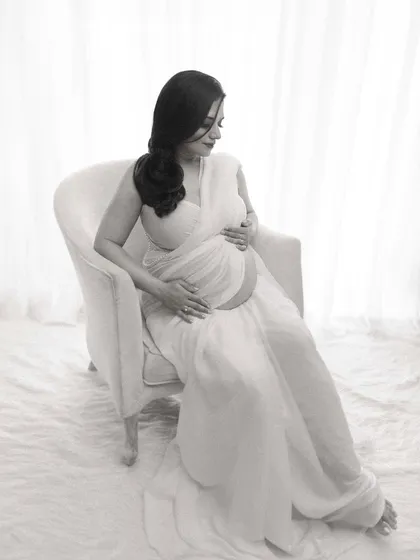 Another angle of the modern white saree look, showing the graceful lines and soft fabric. The focus is on creating a portrait that is both elegant and uniquely styled.