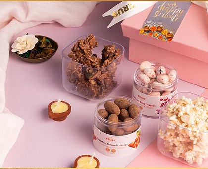 Our Pretty Pink Nuts gift box for Diwali, containing an assortment of gourmet coated nuts and rochers. A delightful and stylish gift for the festive season.