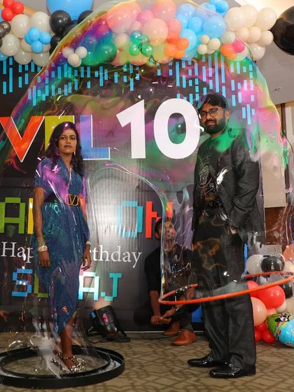 Our bubble act is perfect for couples and anniversaries. Here, we've captured two guests inside a single giant bubble at a 10th anniversary party, creating a unique and memorable photo for their celebration.