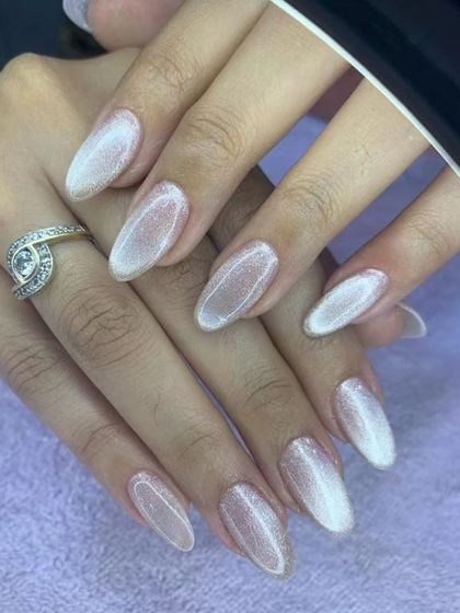 A classic and elegant white cat eye effect. This design gives a pearly, shimmering finish that is perfect for a clean, sophisticated look with a touch of magic.