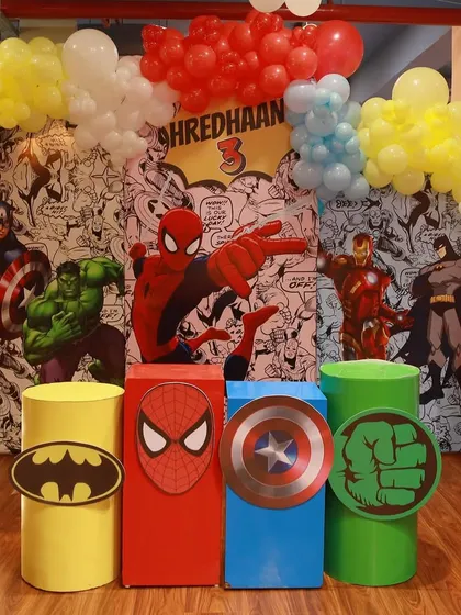 Our superhero themes are a huge hit. This setup features a comic-book-style backdrop and pedestals themed for Batman, Spider-Man, Captain America, and the Hulk, creating the ultimate hero team-up.