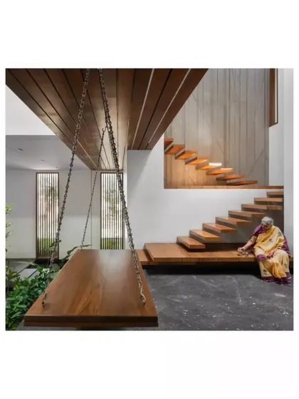 I design spaces for living. This indoor swing and wide, sittable staircase in the Janani House are examples of how I incorporate playful and functional details that encourage relaxation and family interaction.