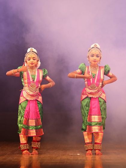 Four of our young students in a classic Bharatanatyam stance. The uniformity in their posture and expression is a result of dedicated practice.