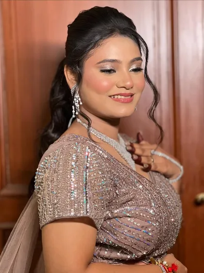 A three-quarter shot of the bride, capturing her elegance and the sparkle of her outfit.