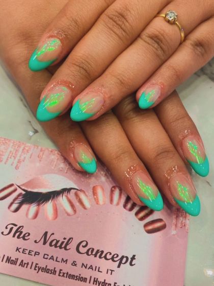 A fresh and unique design with a sheer base and bright turquoise tips. The center of each nail features a hand-painted abstract pattern in a lighter neon green.