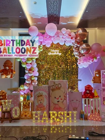 A classic teddy bear theme is perfect for a warm and cuddly celebration. This party features a sparkling gold sequin wall, a pink and gold balloon arch, adorable teddy bears as props, and custom-themed pedestals for the cake and desserts.