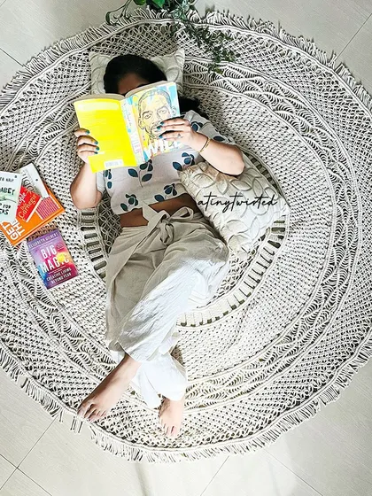 This is what my perfect Sunday looks like. Curled up on one of my handmade macramé rugs, lost in a good book. I designed this piece to be incredibly soft and thick, making it the perfect spot for creating your own cozy corner at home.