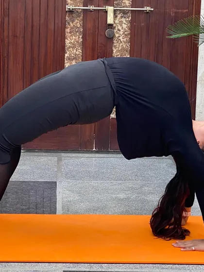Urdhva Dhanurasana, or Wheel Pose, is a deep backbend that opens up the entire front of the body. It builds strength in the arms, legs, and spine, and leaves you feeling energized.
