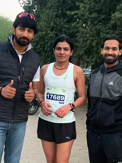 With one of my dedicated female athletes after the SBI Marathon. Her hard work and perseverance are an inspiration to the entire group.