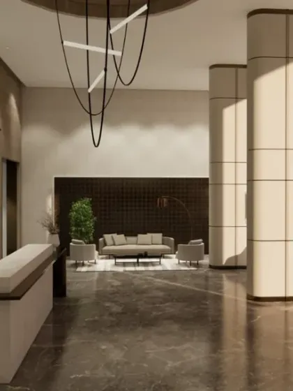 A lobby designed to make a lasting impression. The sculptural chandelier, sleek reception desk, and comfortable waiting area are all carefully curated to blend modern comfort with timeless sophistication.