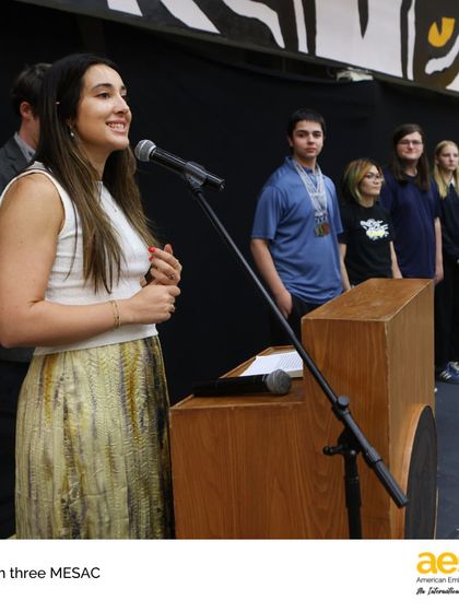 A student-athlete from the Speech & Debate team speaks at the awards ceremony. We empower our students to take on leadership roles and celebrate their peers' achievements.