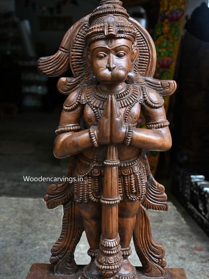 A close-up of the upper body of the 38-inch Hanuman, focusing on his reverent expression and folded hands.