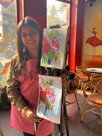 Me at my easel during a floral abstract workshop at a cafe. I'm always ready to help and guide participants.