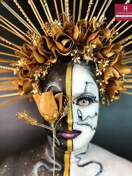 We push creative boundaries in our advanced modules. This striking fantasy makeup look, with its bold black, white, and gold palette and intricate headpiece, demonstrates the high-concept artistry you can master.