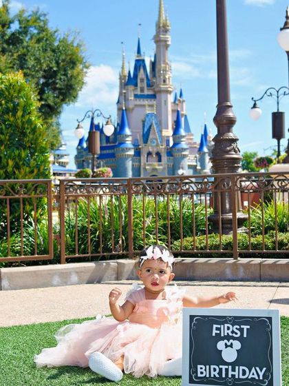 A magical first birthday at the most magical place on Earth. This little one is celebrating at Disneyland in a custom peach tulle gown adorned with delicate butterflies.