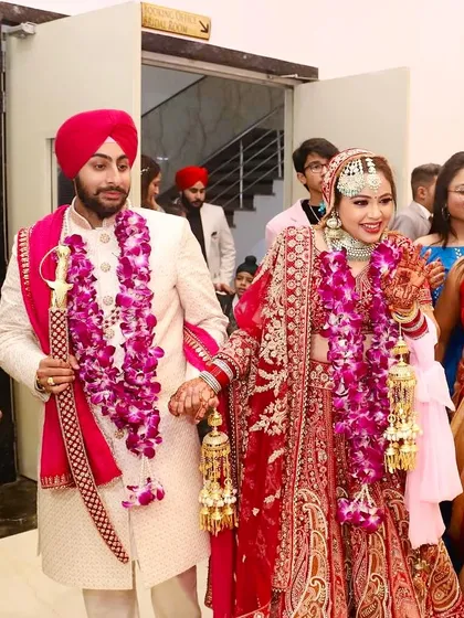 A happy couple walking together after their ceremony. Their smiles are so bright and genuine.
