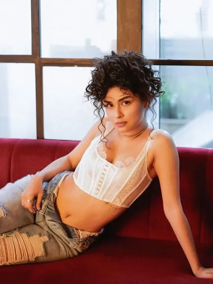 A close-up of Avneet's messy updo. This hairstyle is intentionally imperfect to create a sense of effortless cool, a popular request for modern editorial shoots.