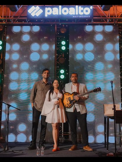 The full trio on stage for Palo Alto Networks. This setup is perfect for filling a room with rich sound without overwhelming the space.