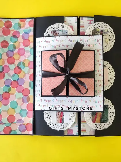 Paper, glue, and a sprinkle of nostalgia. This is a page from a handmade memory album, featuring a pop-up element.