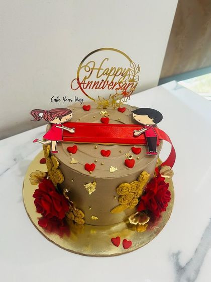 A mocha-colored ribbon-pull cake for a 10th anniversary.